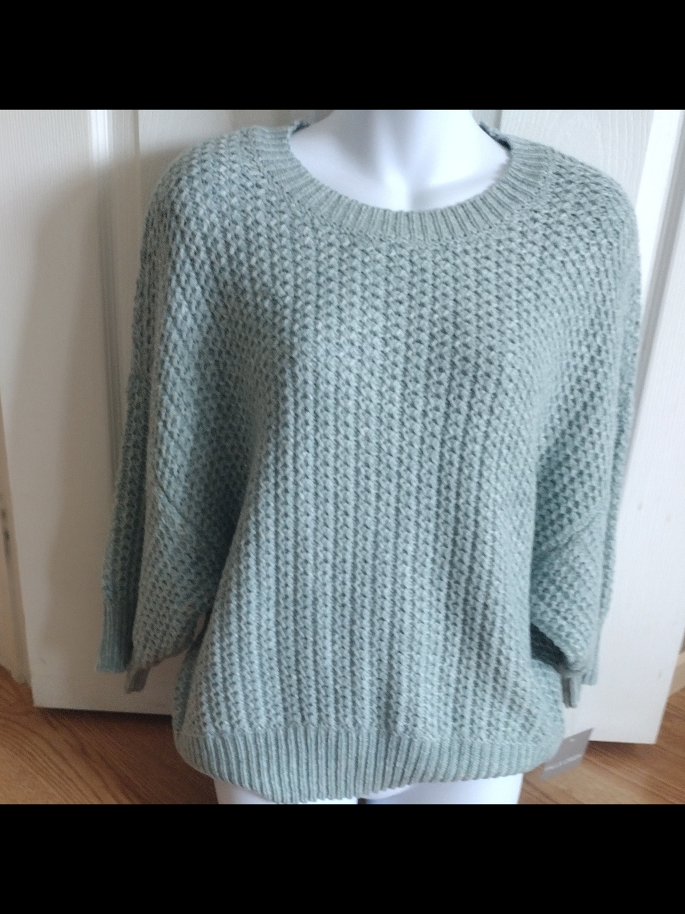 Falls Creek oversized knit sweater features a crew neckline and batwing